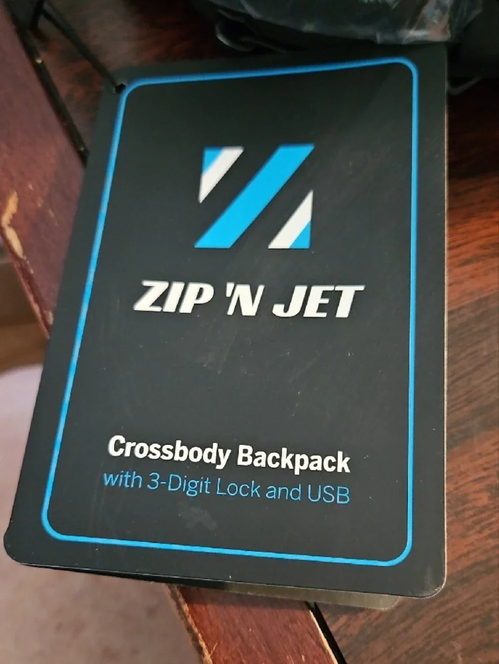 zip n jet black crossbody